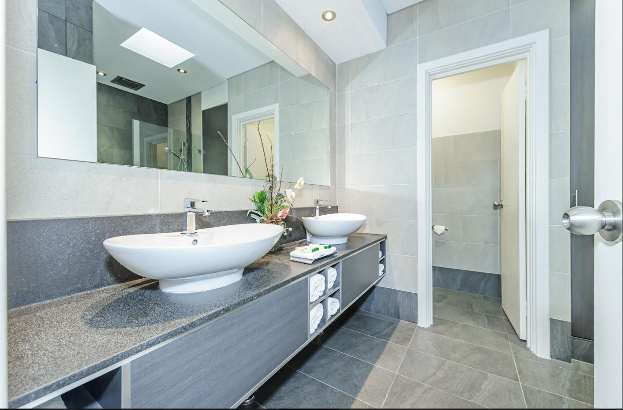 the bathroom of a hotel room at mahogany inn and distillery